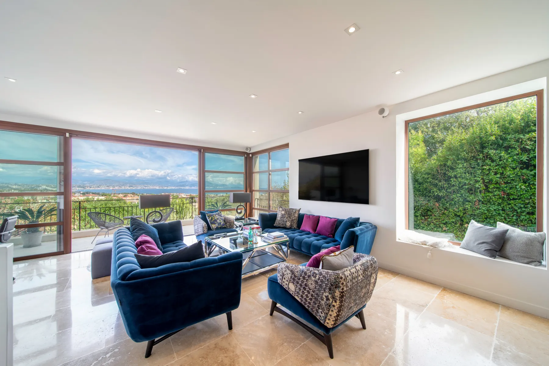 Bright contemporary living room with full width windows