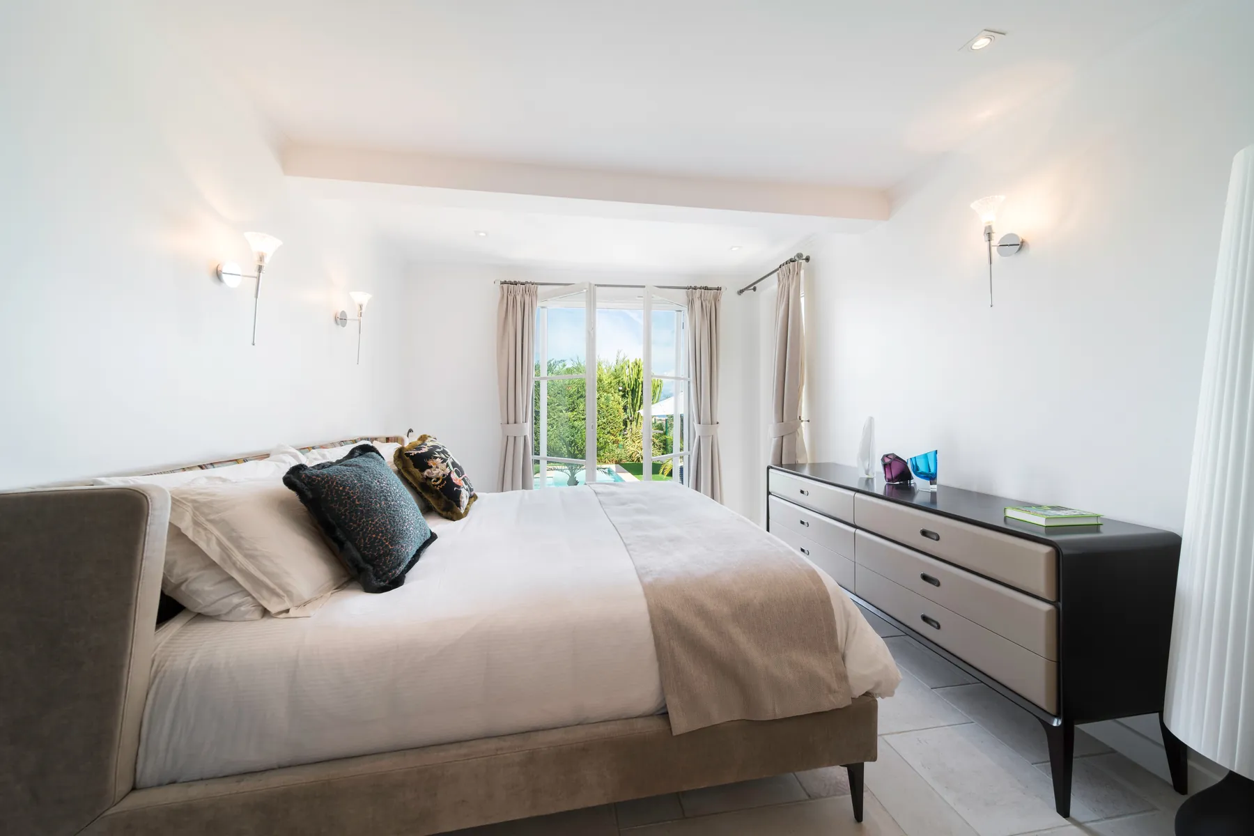 Air conditioned double bedroom with calm neutral furnishings