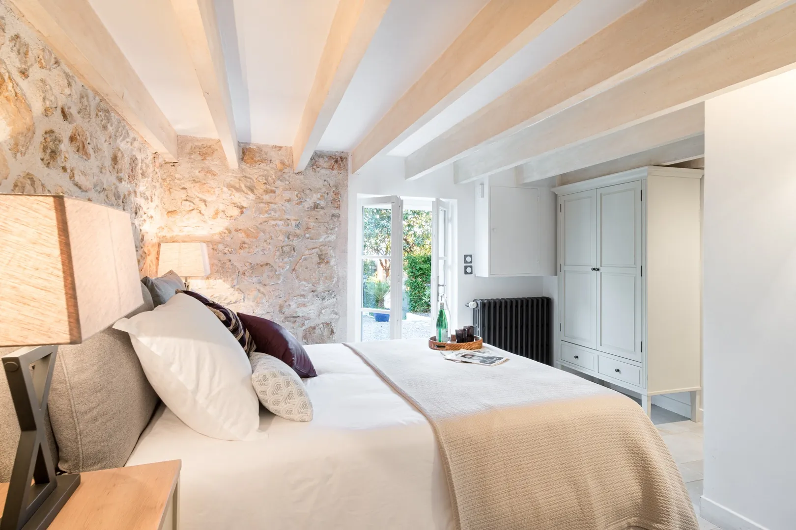 Bedroom 3 with a queen bed and garden doors